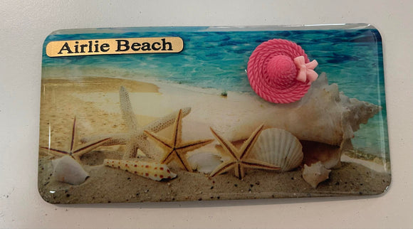 Airlie Beach Shells on Beach and Pink Hat Fridge Magnet